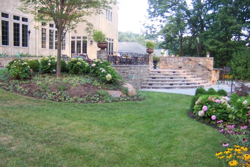 Flower beds and stone patio steps royersford