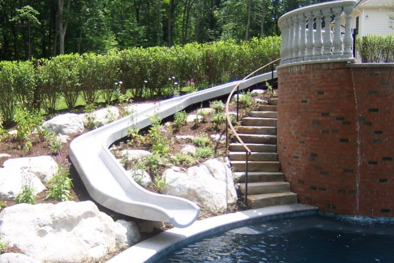 Pool Slide surrounded by beautiful landscape